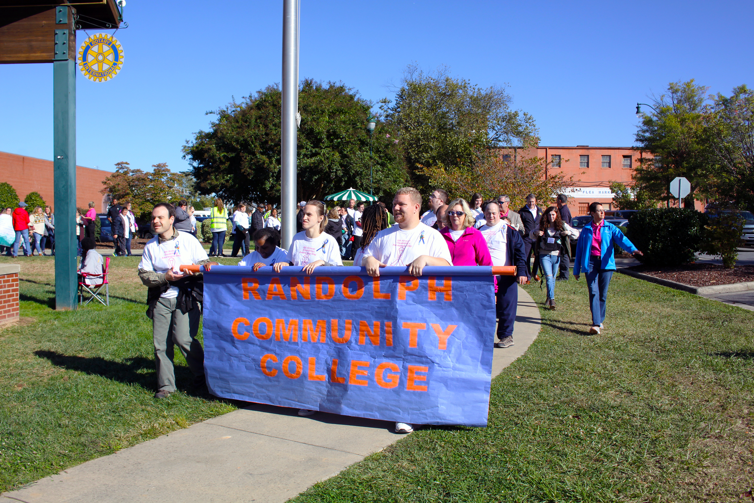 Randolph Community College Adult Basic Life-Skills Education (ABLE) students march into Bicentennial Park as a part of the 6th Annual Disabilities Awareness Day Parade, held Oct. 18 in downtown Asheboro.