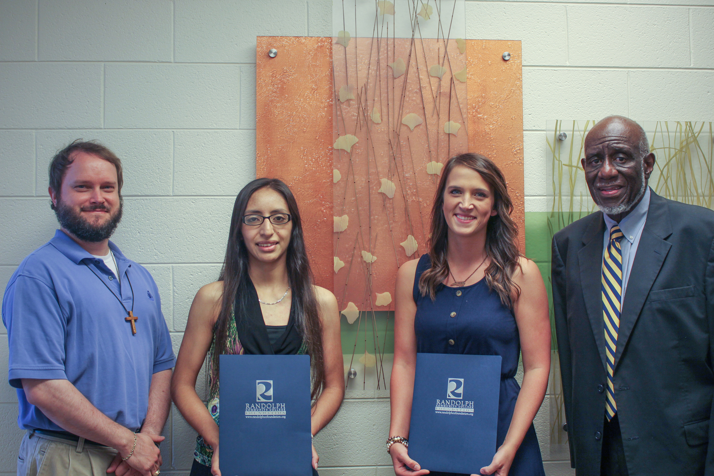 Pictured, left to right, are RCC English/Communication Instructor and PTK Advisor W. Clark Adams, Associate in Arts student Carmen Garcia, Medical Assisting student Regina Hoover, and former Business Administration Department Head and PTK Advisor Waymon C. Martin.