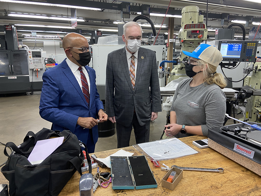 Stith and Shackleford visit with machining student