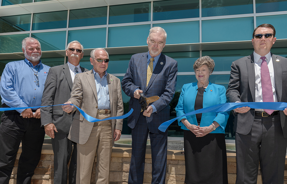 Randolph Community College Dr. Robert S. Shackleford Jr. cuts the ribbon for the Dr. Robert S. Shackleford Jr. Allied Health Center on Wednesday, April 27, as the College hosted a ribbon-cutting for the Center and a retirement party for Shackleford. The President also was awarded the prestigious Order of the Long Leaf Pine during the ceremony. Pictured, left to right, are Director of Operations for Clancy and Theys Construction Tom Haggard, Representative Allen McNeill, Randolph County Board of Commissioners Chair Darrell Frye, Shackleford, Representative Pat Hurley, and Senator Dave Craven.