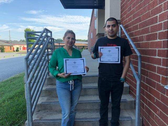 Mirina Perez (left) and son, Christopher, show off the NorthStar certificates they earned in the Career Readiness department’s Digital Literacy course.