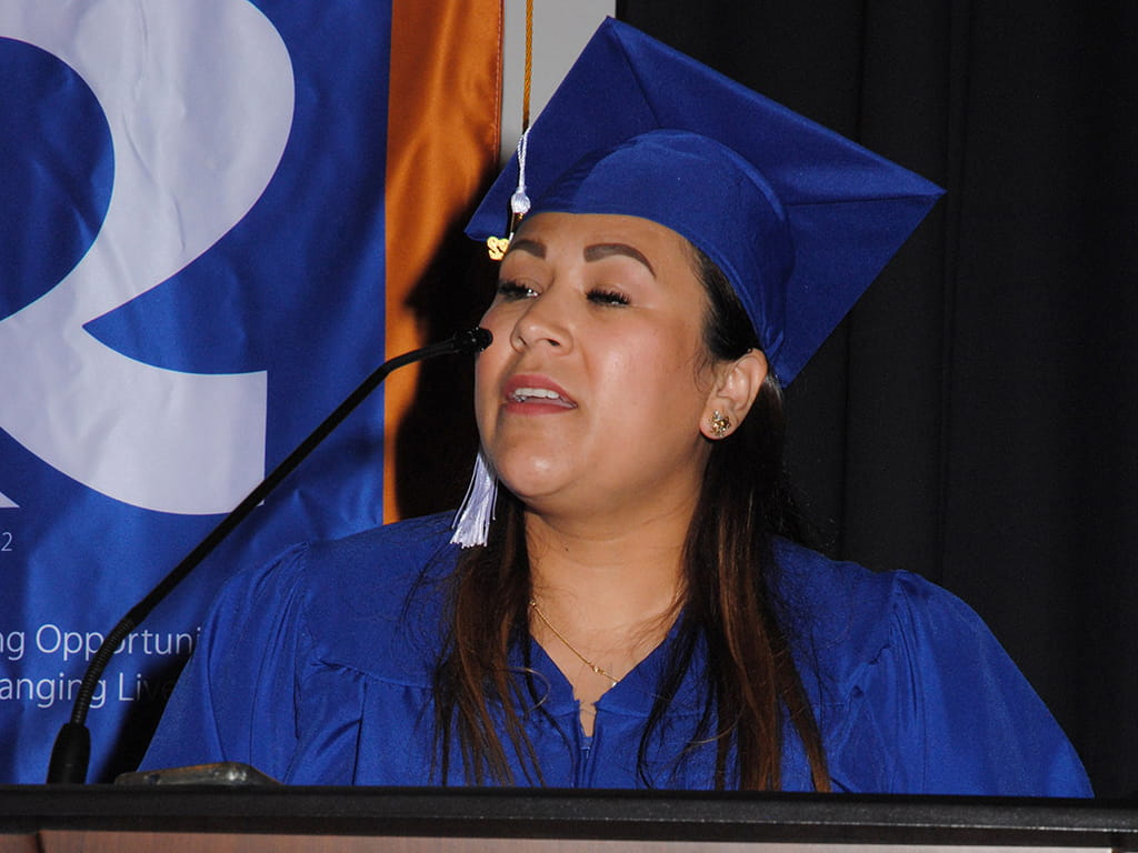 Petra Suarez Hernandez delivers her graduation speech during the 2022 College and Career Readiness Graduation May 12 in the R. Alton Cox Learning Resources Center on the Asheboro Campus.