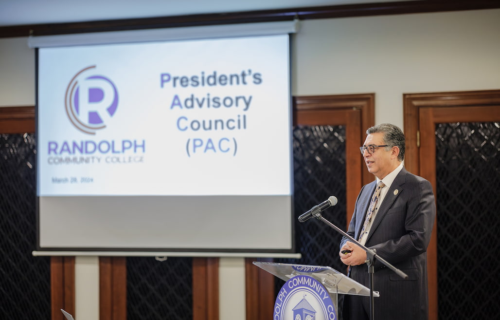 Photo of a person talking at a podium.