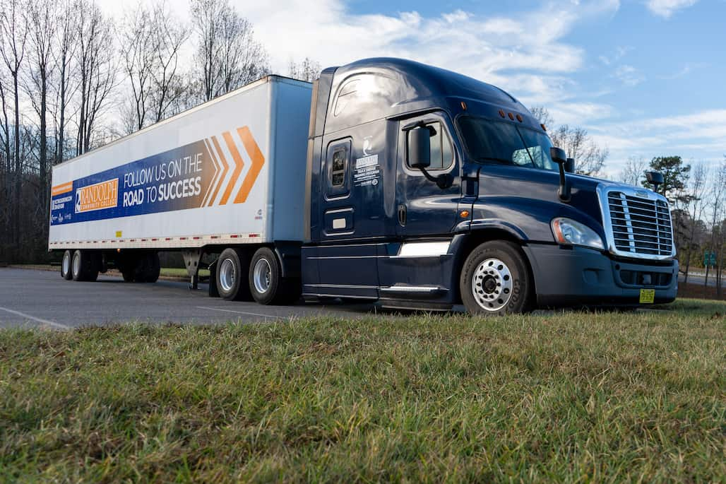 Photo of a truck with a Randolph Community College logo on it.