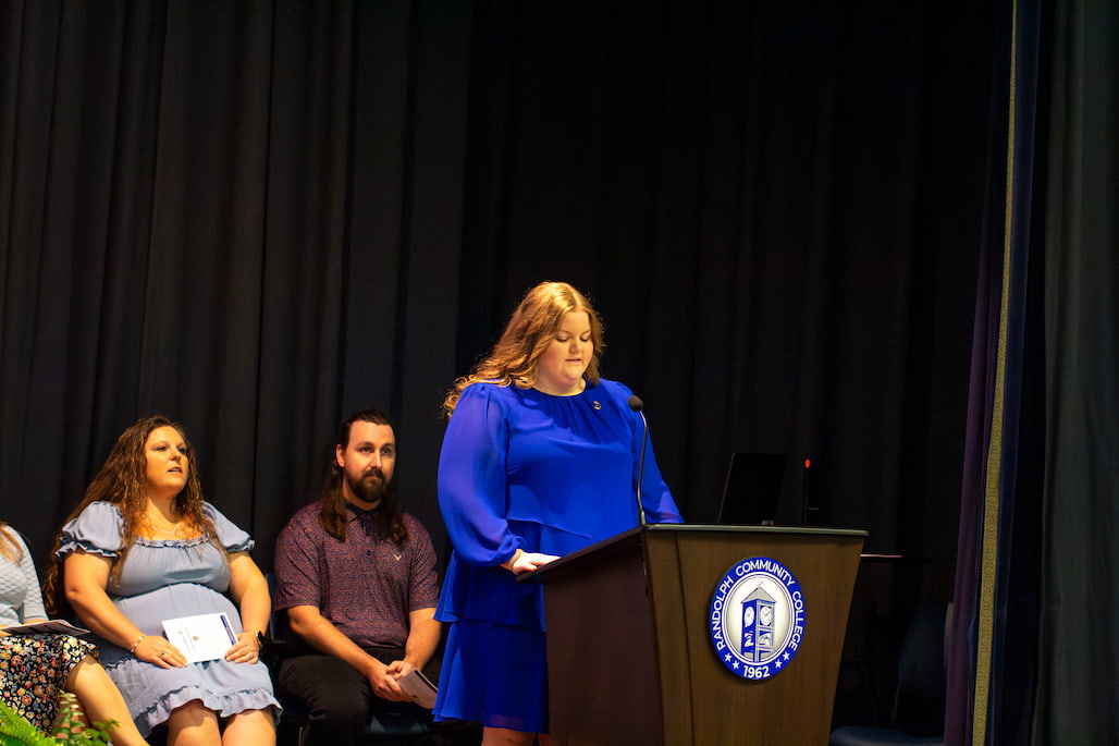 Photo of a person giving a speech at a podium in Randolph Community College's R. Alton Cox Learning Resources Center Auditorium.