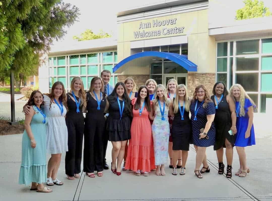 Photo of a group of people posing for a photo in The Plaza at Randolph Community College.