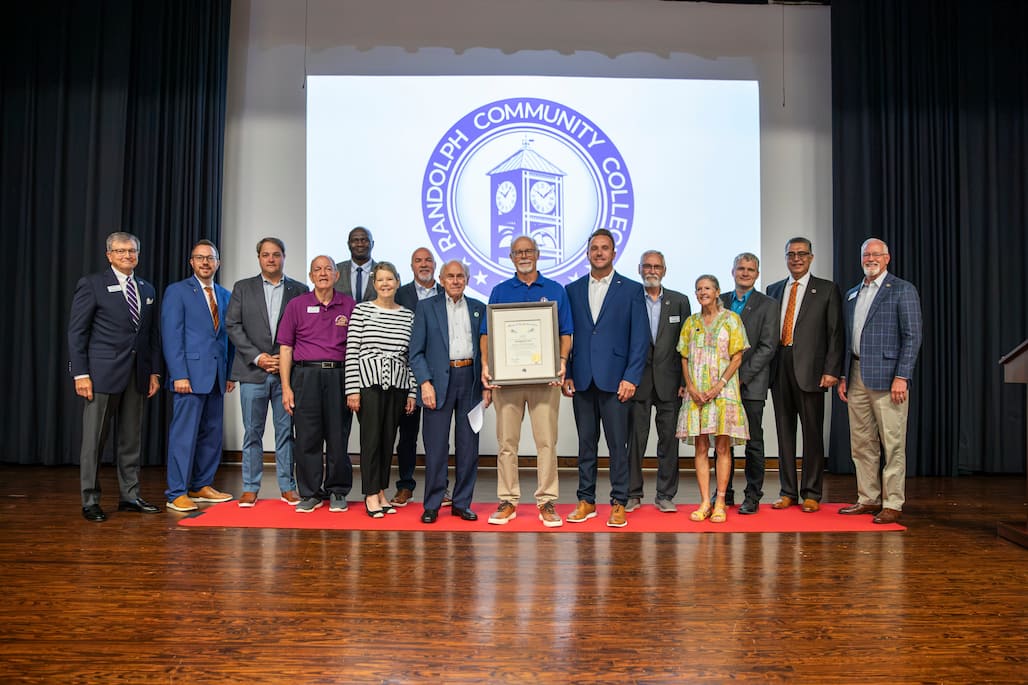 Group photo of Reynolds Lisk and RCC and community leaders.
