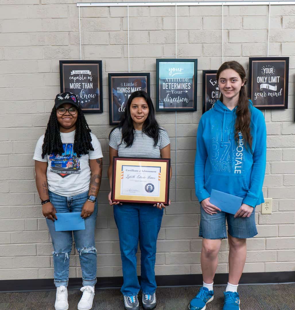 Photo of three students.